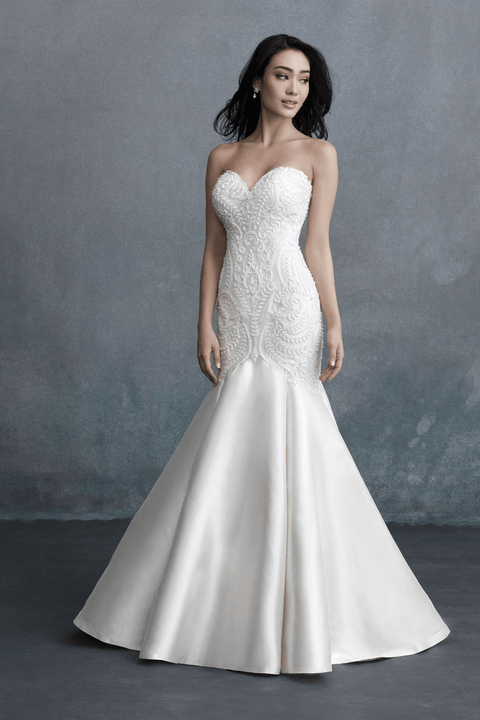 indoor photo of woman wearing white allure couture designer wedding dress