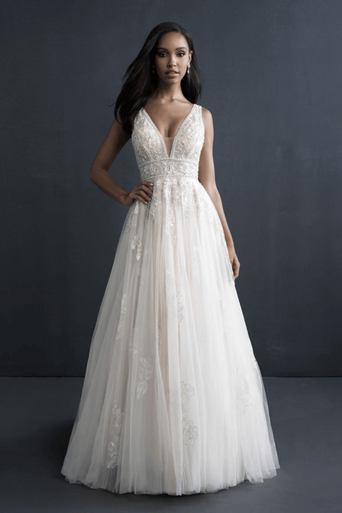 indoor photo of woman wearing white allure couture designer wedding dress
