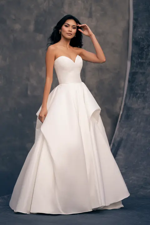 indoor photo of woman wearing white allure couture designer wedding dress