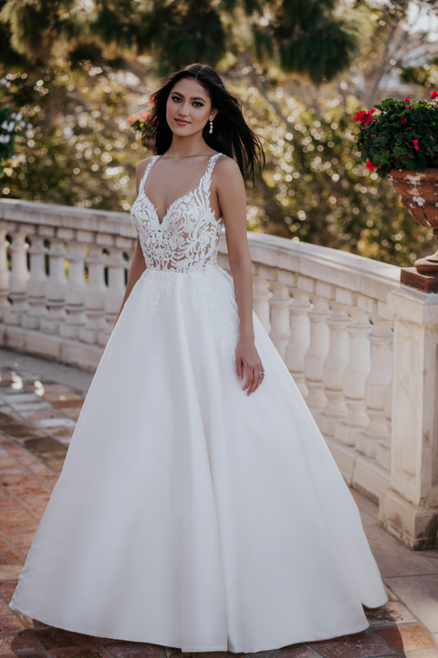 outdoor photo of woman wearing white allure couture designer wedding dress