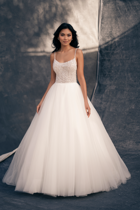 indoor photo of woman wearing white allure couture designer wedding dress