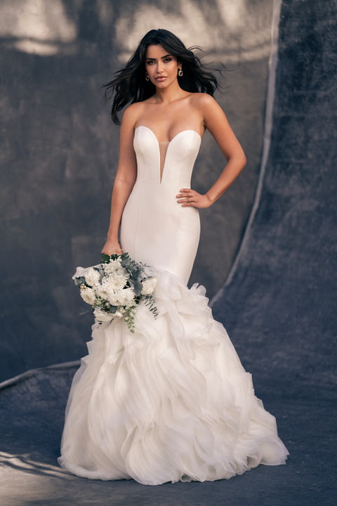 indoor photo of woman wearing white allure couture designer wedding dress