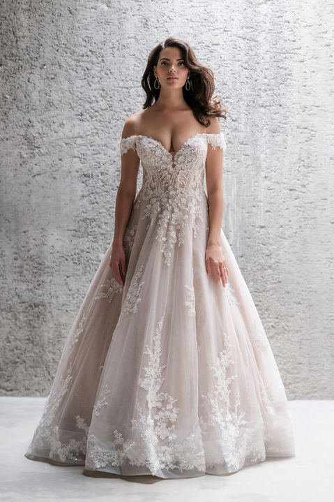 indoor photo of woman wearing white allure couture designer wedding dress