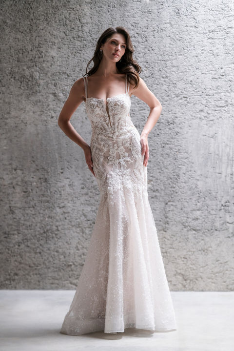 indoor photo of woman wearing white allure couture designer wedding dress