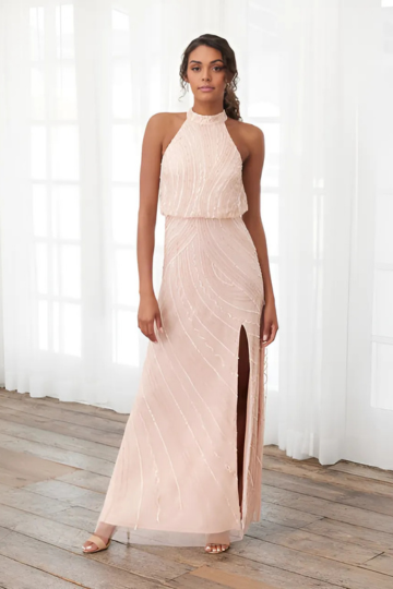 indoor photo of woman wearing pink christina wu designer dress