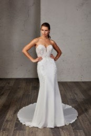 indoor photo of woman wearing white designer eddy k wedding dress