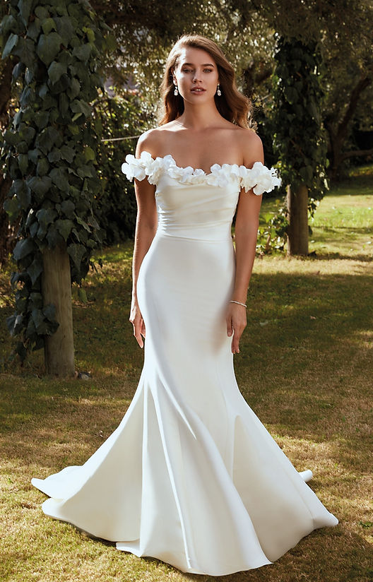outdoor photo of woman wearing designer eddy k wedding dress
