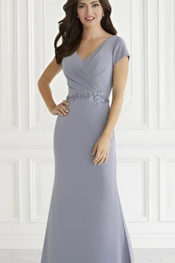 woman wearing light blue designer house of wu dress