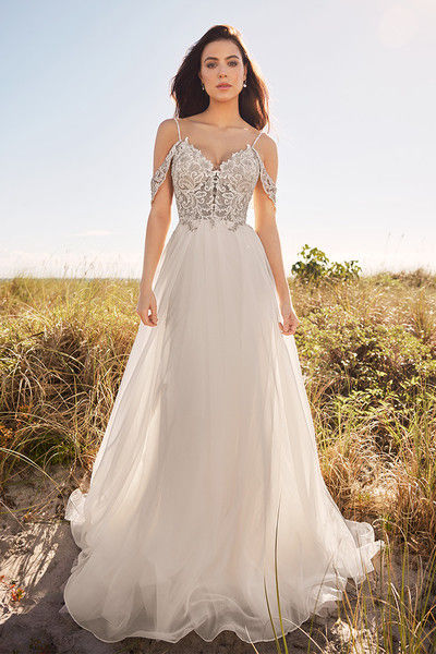 outdoor photo of woman wearing white martin thornburg designer wedding dress