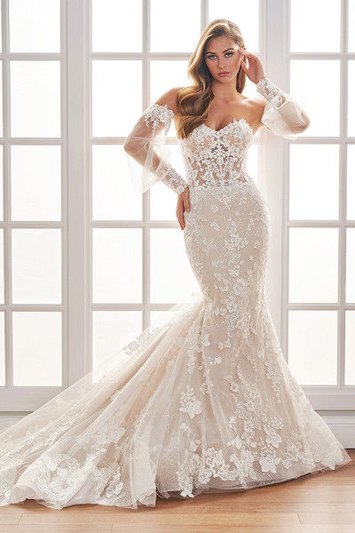 indoor photo of woman wearing white martin thornburg designer wedding dress