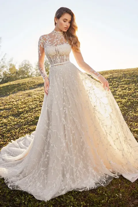outdoor photo of woman wearing white martin thornburg designer wedding dress