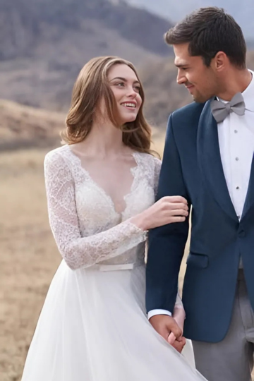 married couple outside wearing designer wedding dress and tuxedo