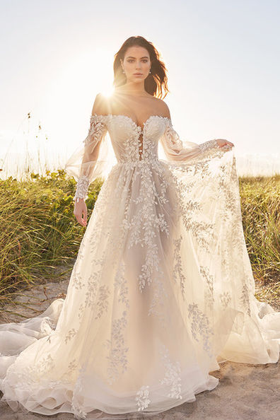 indoor photo of woman wearing white designer montage dress