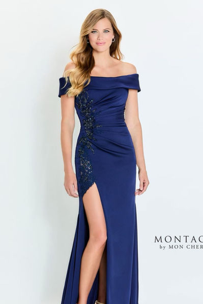 indoor photo of woman wearing blue montage designer dress