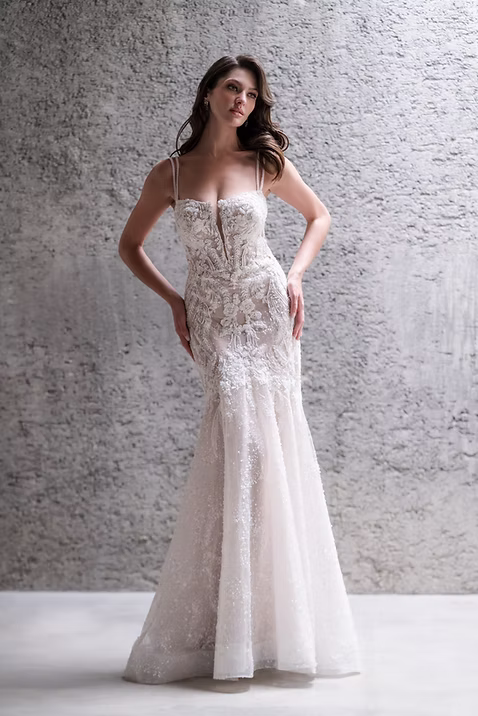 indoor photo of woman in white allure couture designer wedding dress