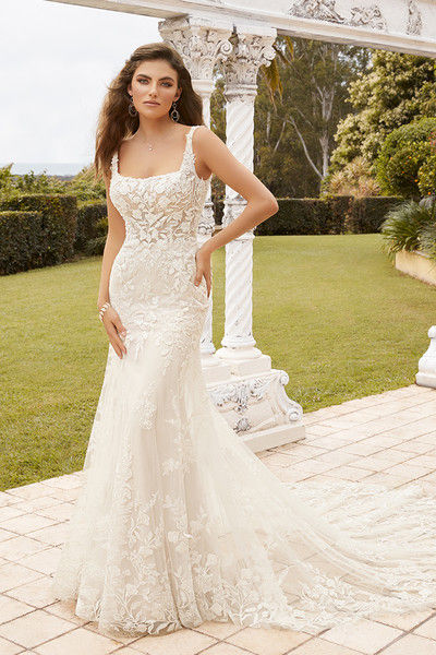 outdoor photo of woman wearing white sophia tolli designer wedding dress