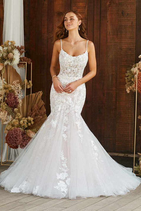 indoor photo of woman wearing white sophia tolli designer wedding dress