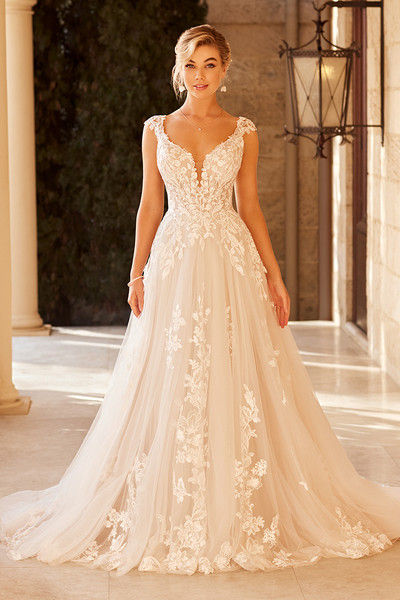 indoor photo of woman wearing white sophia tolli designer wedding dress