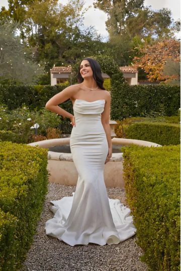 woman wearing white madi lane designer wedding dress outdoors