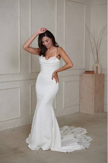 woman wearing white madi lane designer wedding dress indoors
