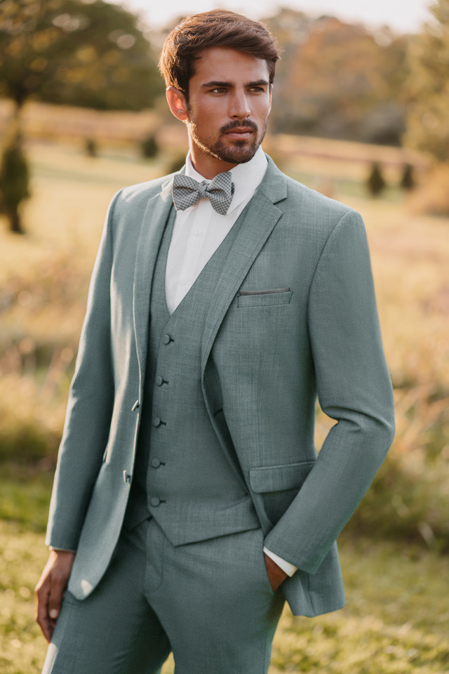 man wearing gray allure menswear tuxedo outdoors