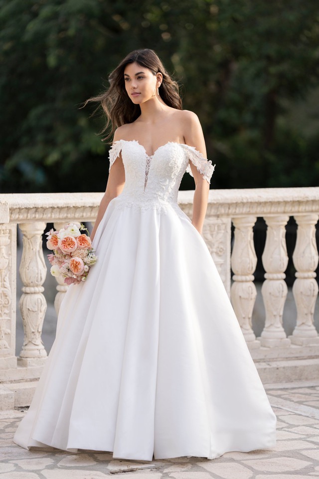 woman wearing white allure couturem designer dress 2025 outdoors