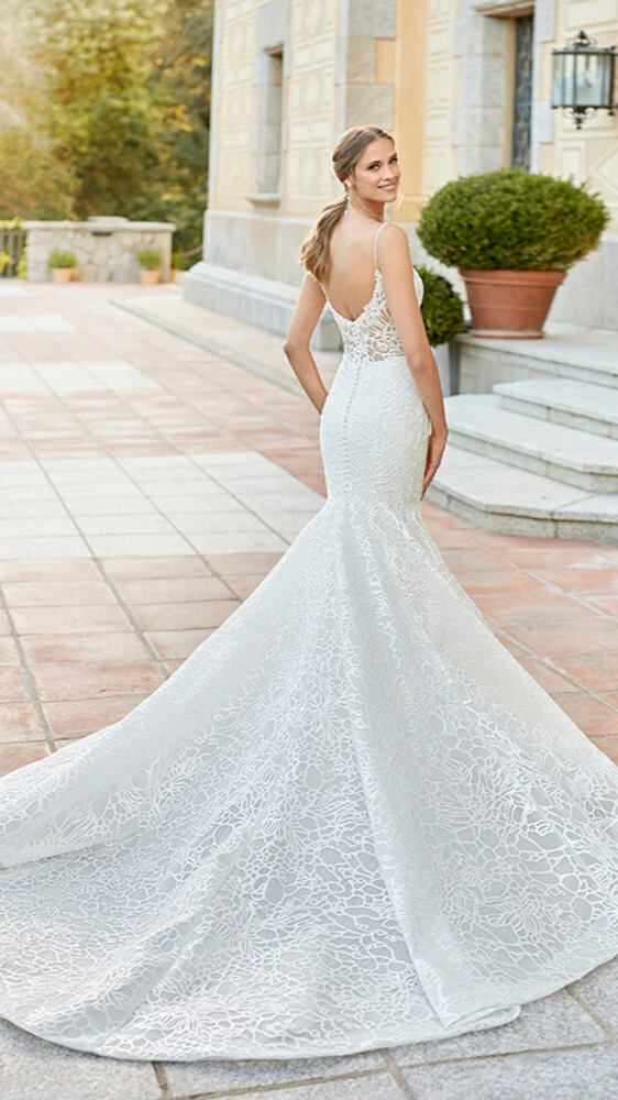 woman wearing white rosa clara designer wedding dress outdoors
